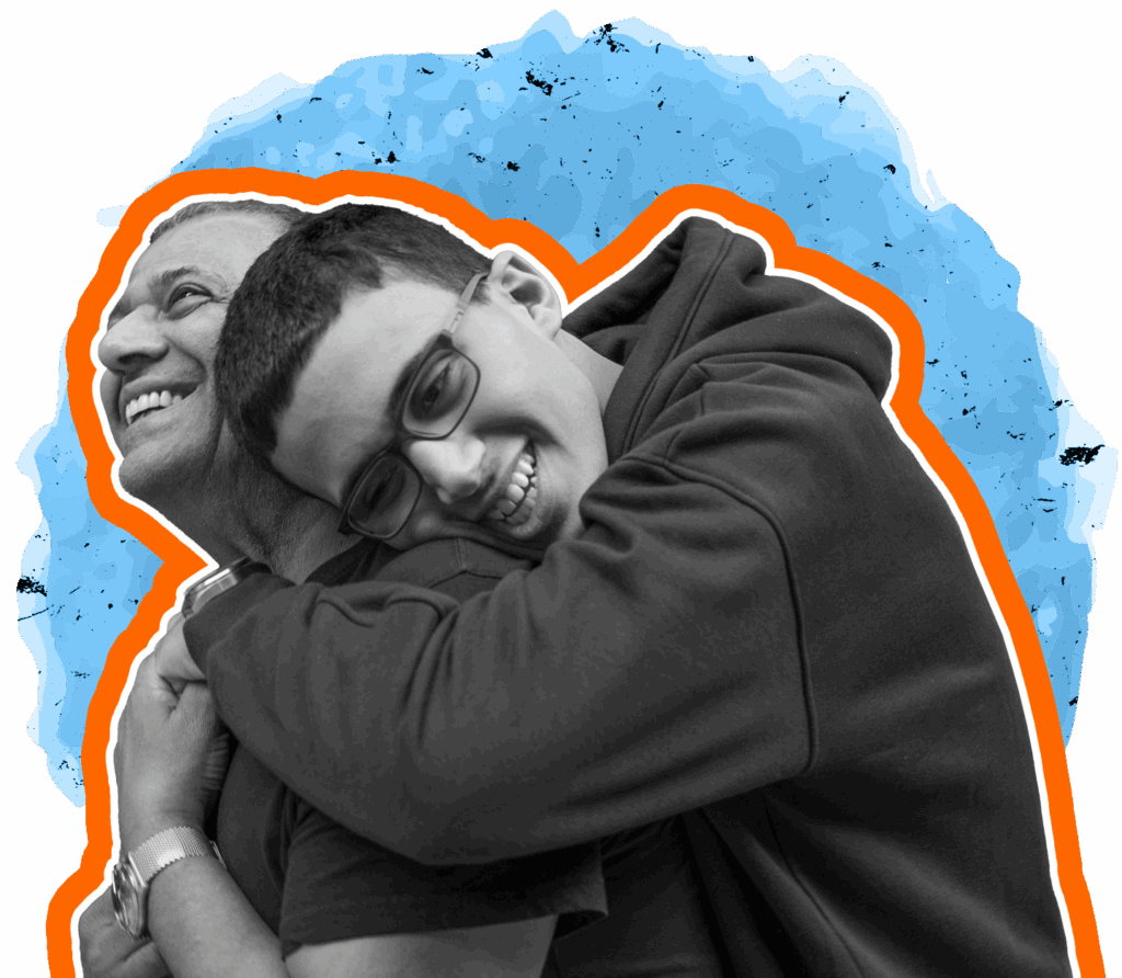 Two people close together in a friendly hug. 