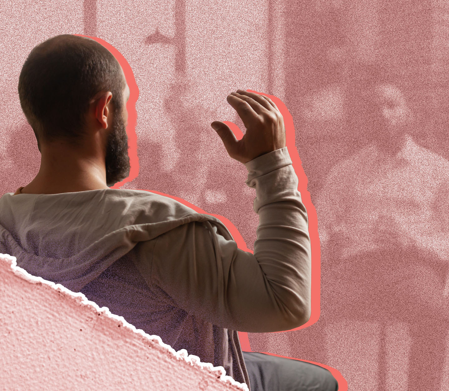 Man with arm raised from behind. 