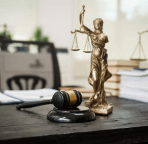 Lady justice statue on the desk of a state legislator with gavel