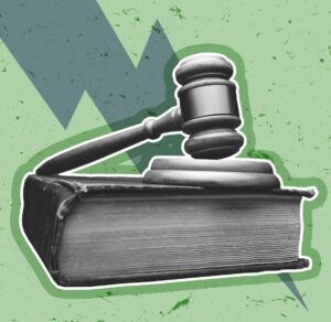 Judge's gavel on a green background